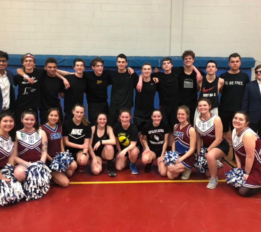 Student players and cheerleaders for the student team after winning the 2019 student/teacher basketball game.