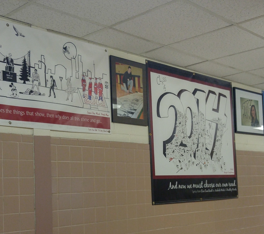 Class murals hang in science hallway